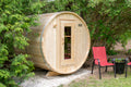 Harmony cedar barrel sauna exterior showing round profile and glass-panel door