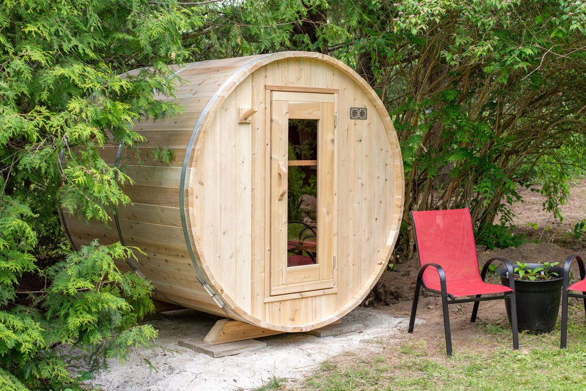 Harmony cedar barrel sauna exterior showing round profile and glass-panel door