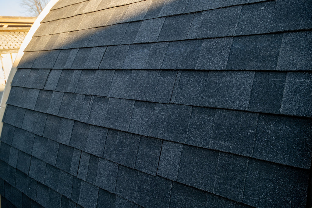 Close-up of MiniPOD black asphalt shingles and curved roof profile